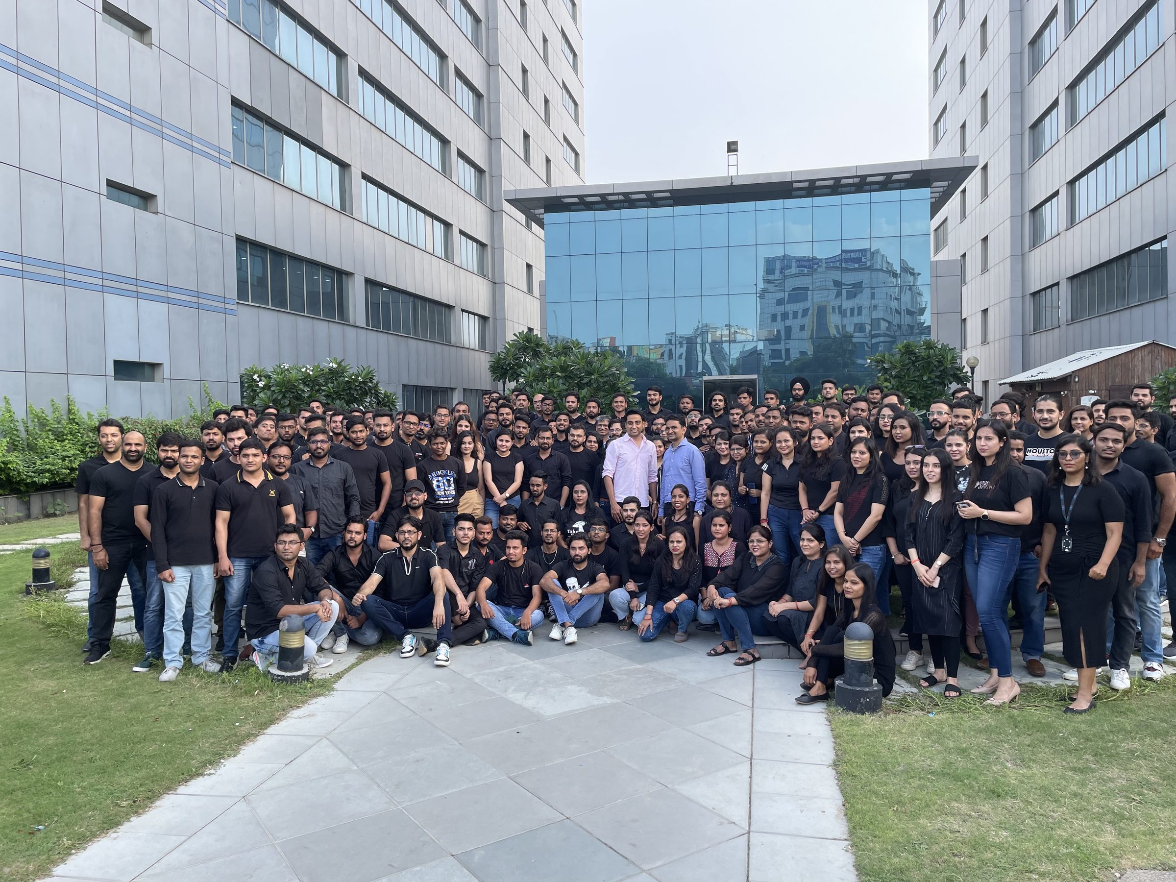 The team, photographed together outside the office
